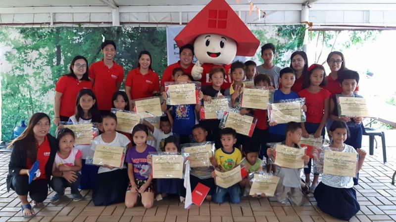 Kids with certificates of participation of Bria's Plant a Tree program Affordable House and Lot