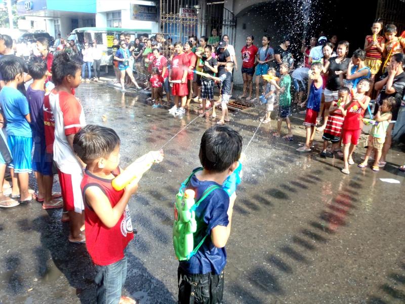 Children enjoying the water war Affordable House and Lot