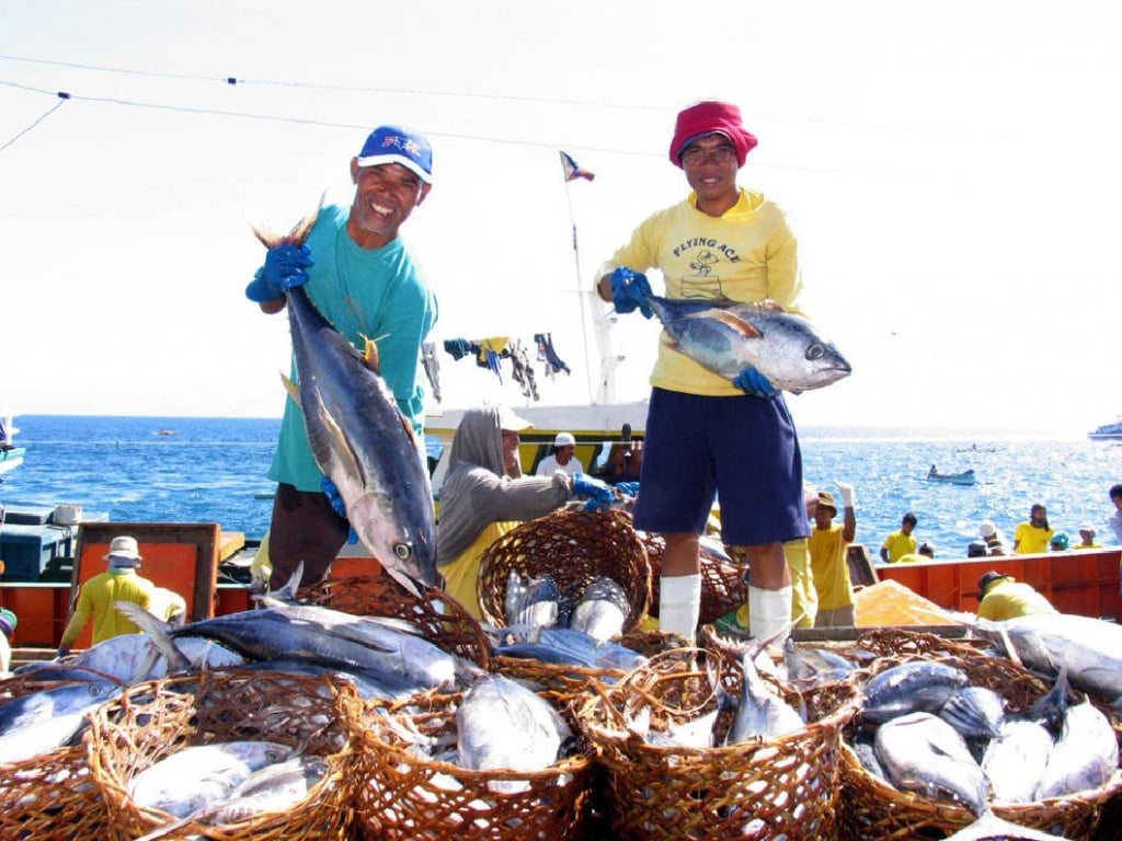 Fishermen with baskets of tuna Affordable House and Lot