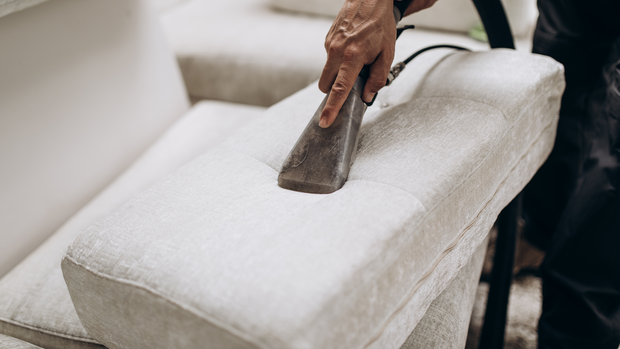 Vacuuming the pillows for deep cleaning